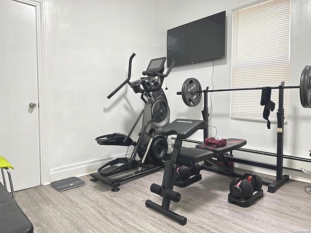 workout room with hardwood / wood-style floors