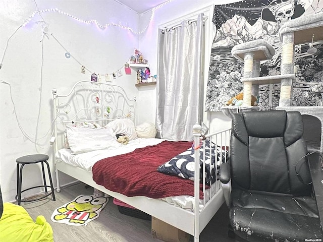 bedroom with wood-type flooring