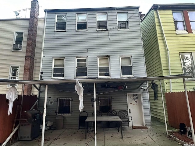 back of house featuring cooling unit and a patio area