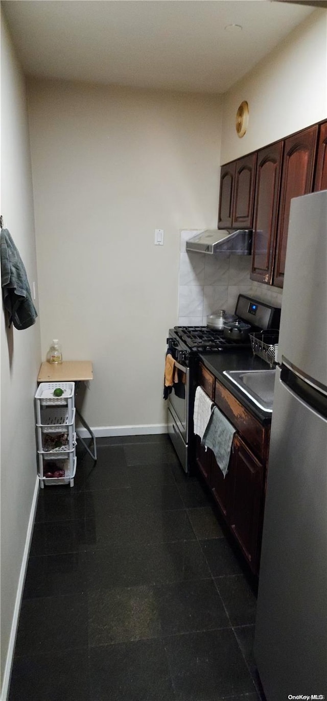 kitchen featuring backsplash, exhaust hood, sink, appliances with stainless steel finishes, and dark brown cabinets