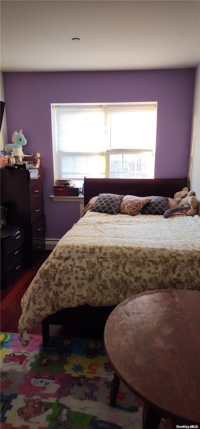 bedroom featuring dark hardwood / wood-style floors