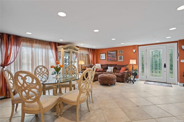 dining space featuring a wealth of natural light and light tile patterned flooring