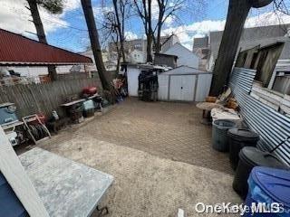 view of patio / terrace featuring a shed