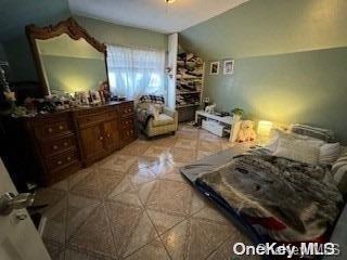 bedroom with vaulted ceiling