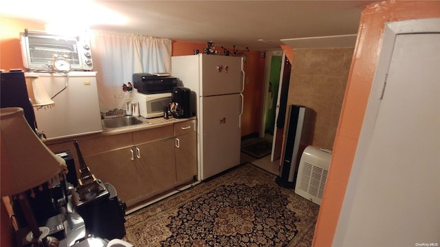 kitchen featuring sink and white appliances