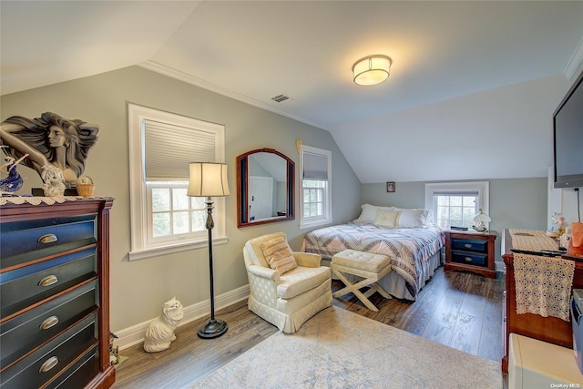 bedroom featuring dark hardwood / wood-style flooring and lofted ceiling