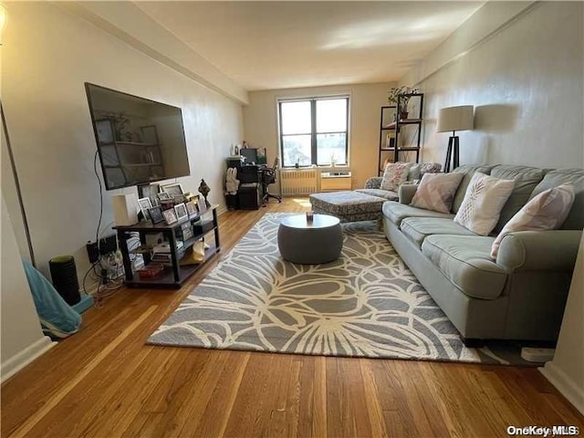 living room featuring radiator and hardwood / wood-style flooring