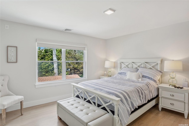 bedroom with light hardwood / wood-style flooring