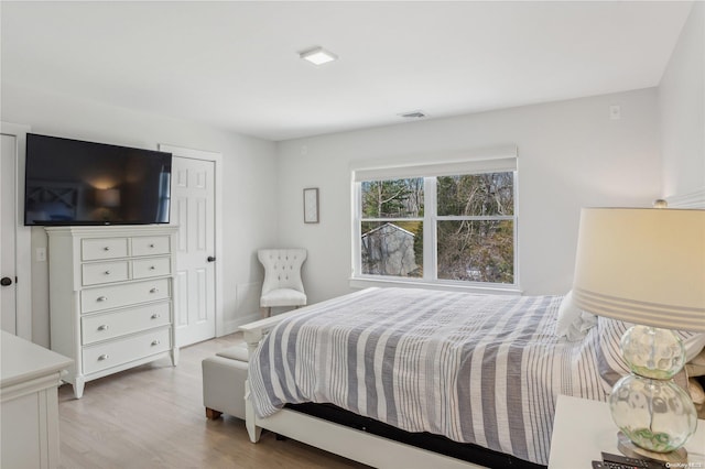 bedroom with light hardwood / wood-style floors