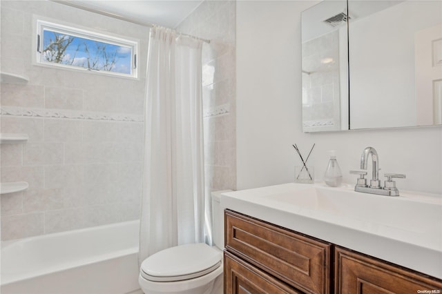 full bathroom featuring shower / bath combination with curtain, toilet, and vanity