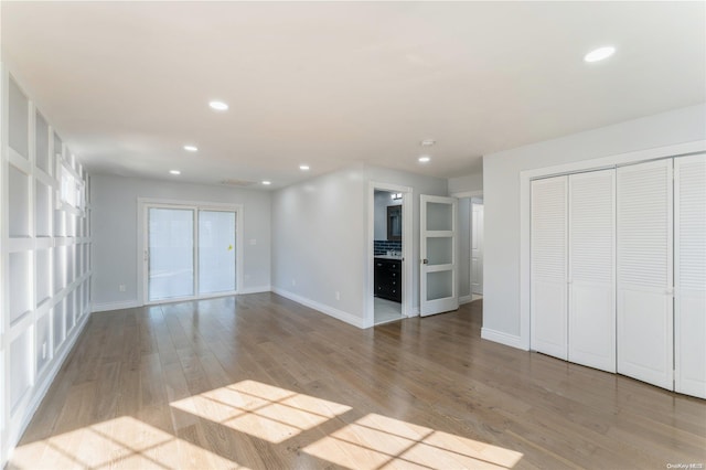 unfurnished living room featuring light hardwood / wood-style floors