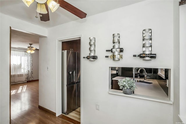 corridor featuring hardwood / wood-style floors and sink