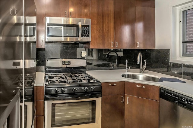 kitchen featuring decorative backsplash, sink, and stainless steel appliances