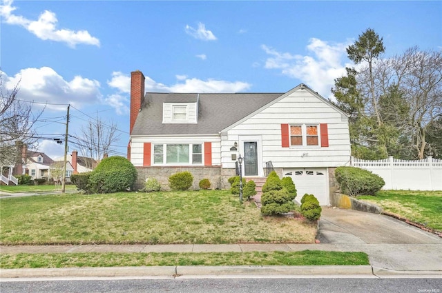 view of front of house featuring a front lawn and a garage