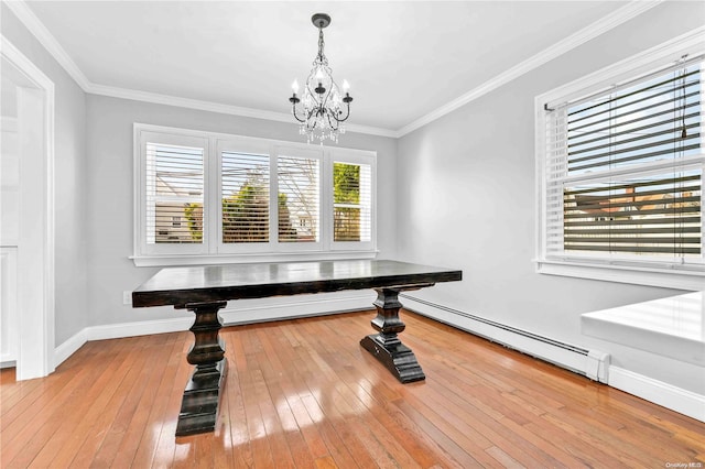 dining room with an inviting chandelier, ornamental molding, light hardwood / wood-style flooring, and a baseboard radiator