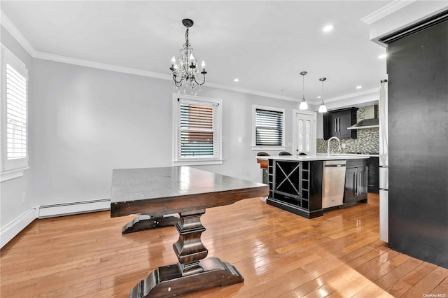 kitchen with dishwasher, backsplash, light hardwood / wood-style flooring, and ornamental molding