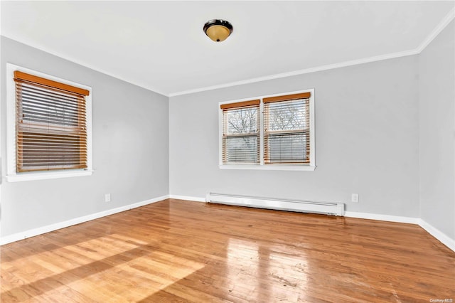 unfurnished room with hardwood / wood-style floors, crown molding, and a baseboard radiator