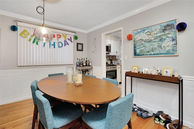 245 W Chester St W, Long Beach, NY 11561 - dining area featuring ornamental molding and light wood finished floors