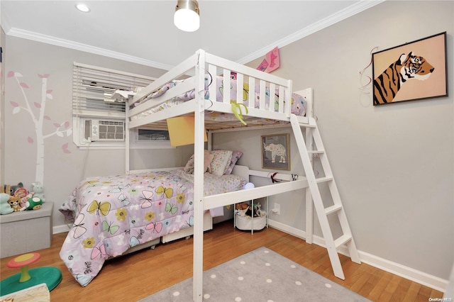 bedroom with wood-type flooring, cooling unit, and crown molding