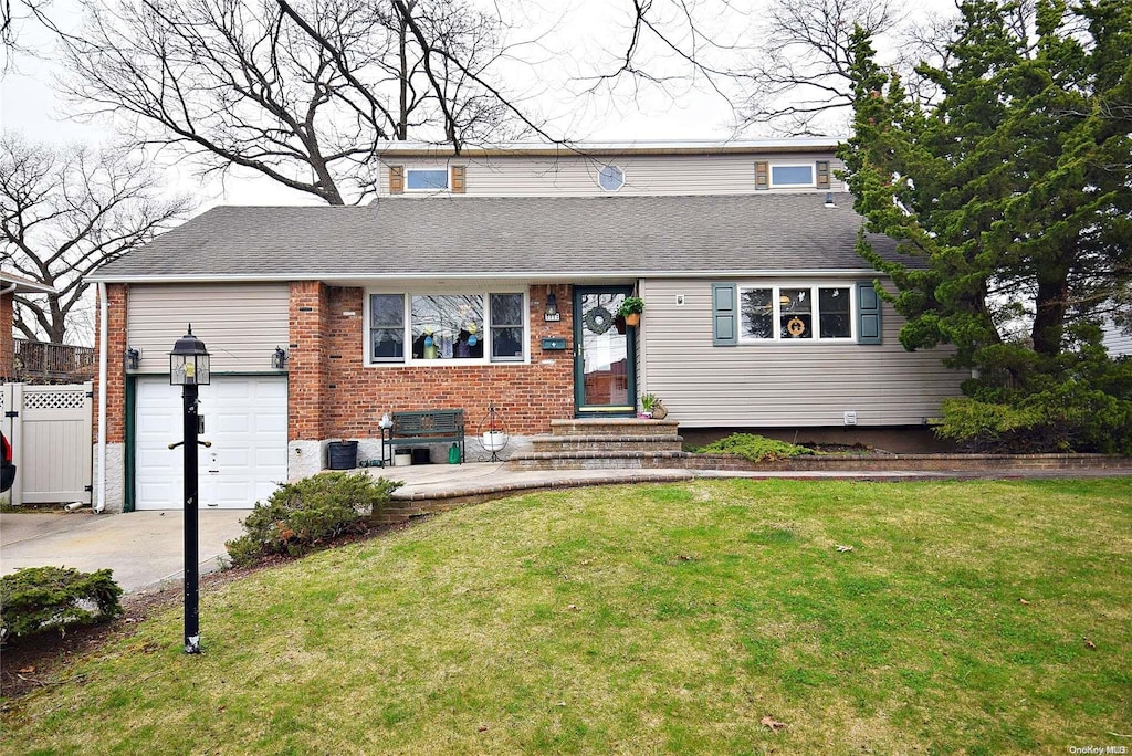 view of front of property with central AC, a garage, and a front lawn