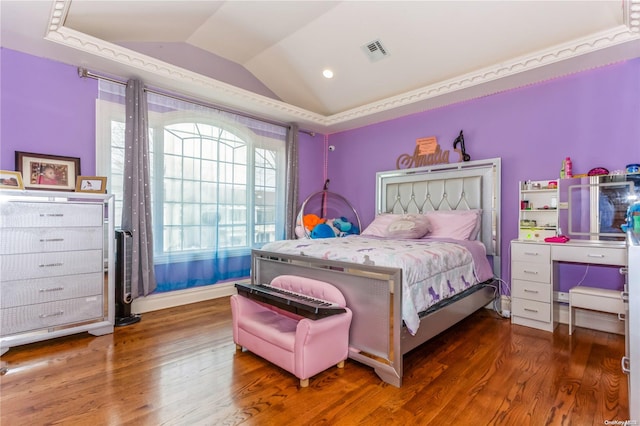 bedroom featuring dark hardwood / wood-style floors and lofted ceiling