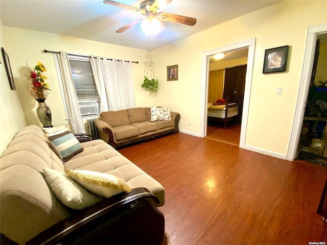 living room featuring ceiling fan and wood-type flooring