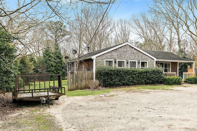 view of side of property featuring a porch