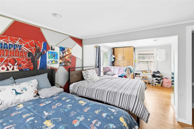 bedroom with hardwood / wood-style floors