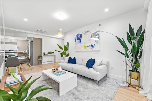 living room featuring light wood-type flooring