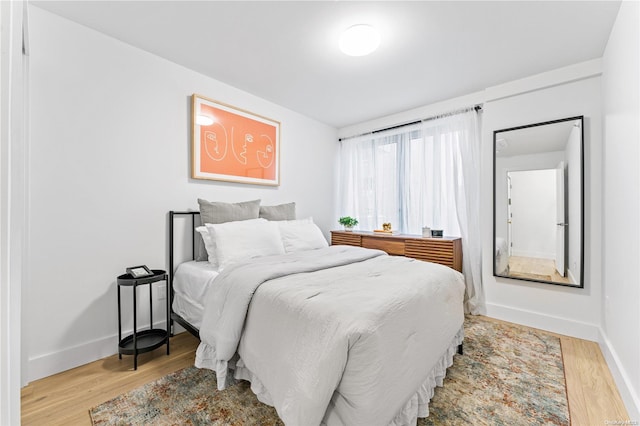 bedroom with light wood-type flooring