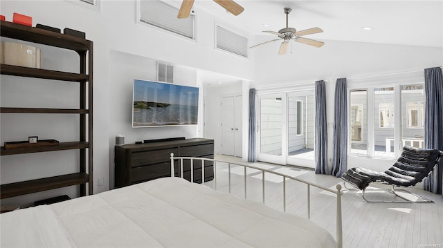 bedroom with access to exterior, ceiling fan, high vaulted ceiling, and light wood-type flooring