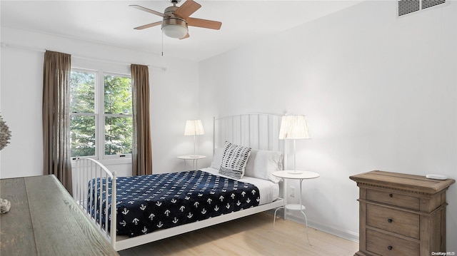 bedroom featuring ceiling fan and light hardwood / wood-style floors