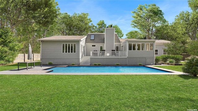 rear view of house featuring a yard, a pool side deck, and a sunroom