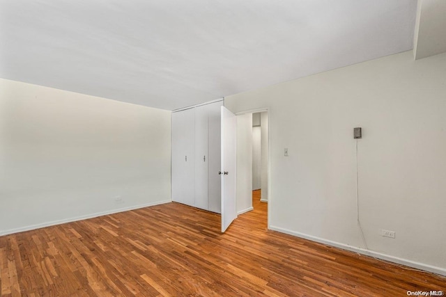 unfurnished room with light hardwood / wood-style flooring