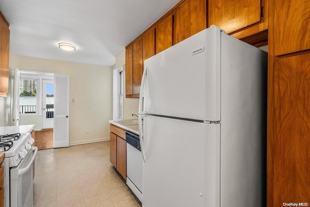 kitchen with sink and white appliances