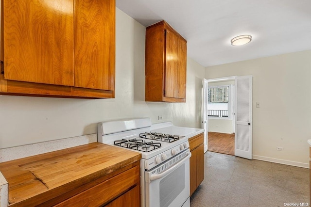 kitchen with white gas stove