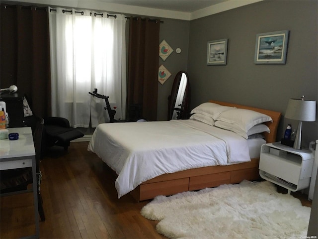 bedroom featuring hardwood / wood-style flooring