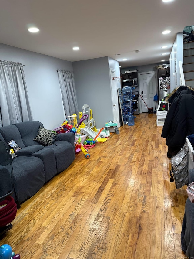 playroom with light hardwood / wood-style flooring