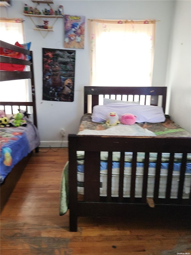 bedroom featuring wood-type flooring