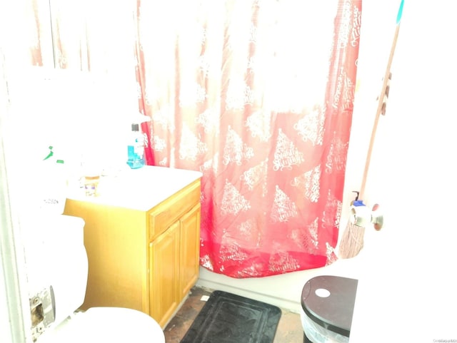 full bathroom featuring vanity, shower / bath combination with curtain, and toilet