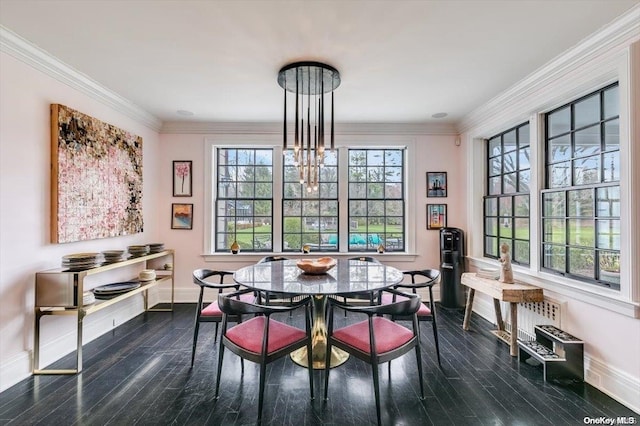 dining area with dark wood-type flooring, a notable chandelier, and ornamental molding