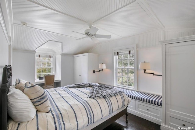 bedroom featuring multiple windows, ceiling fan, dark hardwood / wood-style flooring, and vaulted ceiling