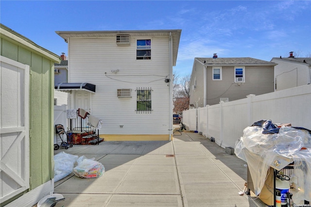 rear view of property featuring a patio