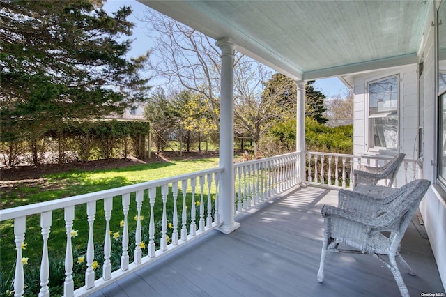 wooden deck featuring covered porch