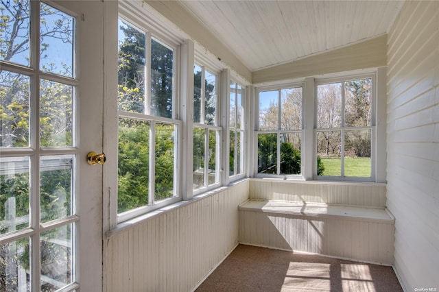 unfurnished sunroom with vaulted ceiling