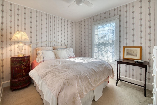12115 Main Rd, East Marion, NY 11939 - bedroom featuring wallpapered walls, carpet, ceiling fan, and baseboards