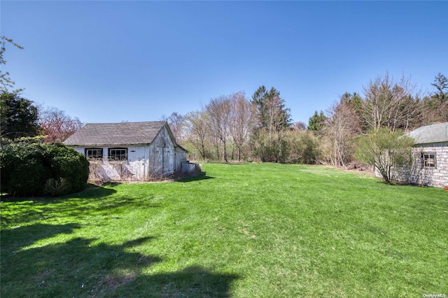 12115 Main Rd, East Marion, NY 11939 - view of green lawn featuring an outdoor structure