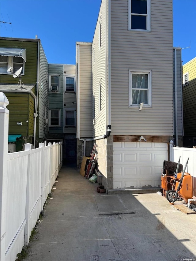 view of side of home with a garage