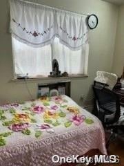 bedroom featuring multiple windows