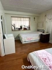 bedroom featuring dark hardwood / wood-style floors